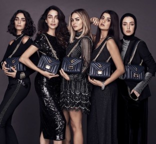 Michael Kors introducing the Whitney Handbag Across the Middle East